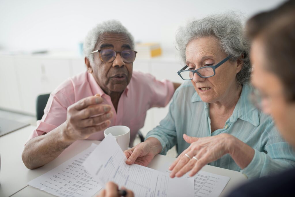 Elderly couple choosing the right Medicare coverage for their lives